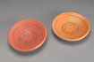 Circular stoneware platters 17 cm diameter [CP 1-3] orange matt glaze [SOLD]; [CP 1-4] red matt glaze. $45 per item 